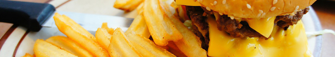 Eating Burger at Burgers & More restaurant in Winfield, AL.